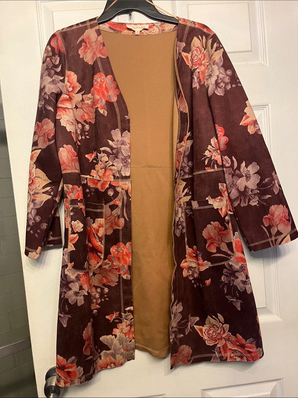 Solitaire Brown floral jacket. Beautiful for fall. 2 pockets in front.